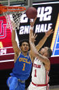 Utah forward Timmy Allen, right, shoots as UCLA guard Jules Bernard defends during the second half of an NCAA college basketball game Thursday, Feb. 25, 2021, in Salt Lake City. (AP Photo/Rick Bowmer)