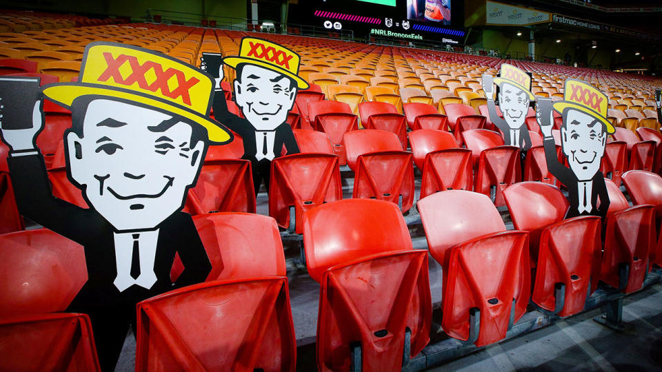 Seen here, cardboard cutouts have replaced real fans in the stands at Suncorp Stadium.