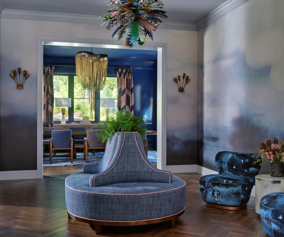 hallway with circular seat with pink trim cloud wallcovering