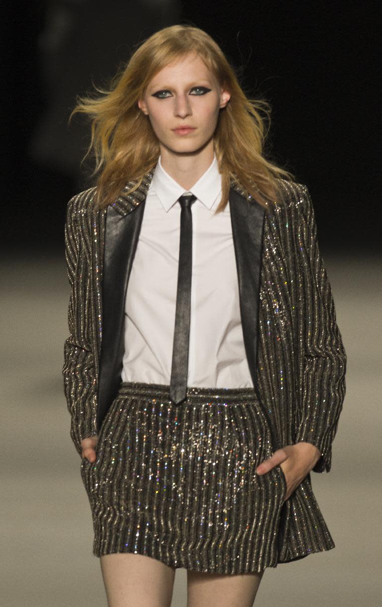 A model wears a creation by Born French fashion designer Hedi Slimane for St Laurent ready-to-wear Spring/Summer 2014 fashion collection, presented in Paris, Monday, Sept.30, 2013. (AP Photo/Jacques Brinon)