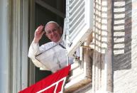 Pope Francis waves as he leads his Sunday Angelus prayer in Saint Peter's square at the Vatican February 26, 2017. REUTERS/Alessandro Bianchi