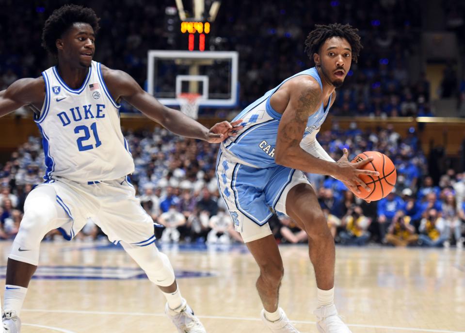 North Carolina’s Leaky Black drives on Duke’s AJ Griffin, left, during the Tar Heels’ upset victory earlier this month at Cameron Indoor Stadium.