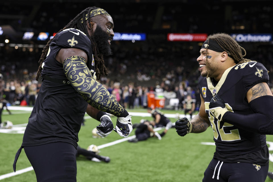 Demario Davis #56 of the New Orleans Saints talks with Tyrann Mathieu #32 