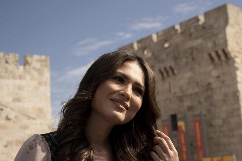 Andrea Meza, the reigning Miss Universe from Mexico, speaks during an interview before touring the Old City of Jerusalem, Wednesday, Nov. 17, 2021, ahead of the 70th Miss Universe pageant being staged in the southern Israeli resort city of Eilat next month. She said Wednesday that the long-running beauty pageant shouldn't be politicized, even as its next edition is being held in Israel and contestants have faced pressure to drop out in solidarity with the Palestinians. (AP Photo/Maya Alleruzzo)