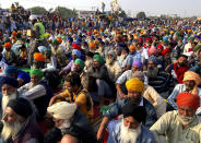 Indian farmers protesting new agriculture laws hold a meeting at the Delhi-Haryana state border, Monday, Nov. 30, 2020. Indian Prime Minister Narendra Modi tried to placate thousands of farmers protesting new agriculture laws Monday and said they were being misled by opposition parties and that his government would resolve all their concerns. (AP Photo/Rishi Lekhi)