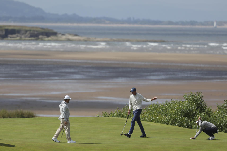 South Africa's Christo Lamprecht (amateur), acknowledges the crowd after putting on the 17th green on the first day of the British Open Golf Championships at the Royal Liverpool Golf Club in Hoylake, England, Thursday, July 20, 2023. (AP Photo/Peter Morrison)