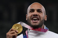 FILE - Lamont Marcell Jacobs, of Italy poses with his gold medal following the men's 100-meters final at the 2020 Summer Olympics, Monday, Aug. 2, 2021, in Tokyo. This year could be more memorable for Jacobs than his breakout 2021 when he sprinted from virtual unknown to Olympic 100-meter champion then added another surprising gold at the Tokyo Games with Italy's 4x100-meter relay team. Jacobs tells The Associated Press that "winning these next two big events would mean winning everything there is to win in athletics."(AP Photo/Francisco Seco, File)