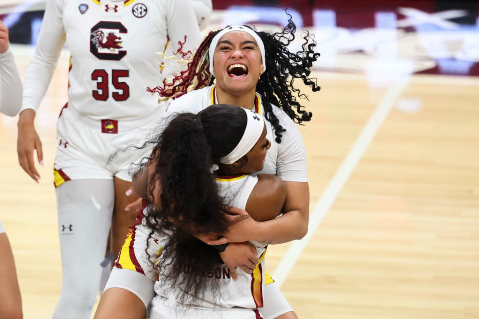 Te-Hina Paopao #0 of the South Carolina Gamecocks celebrates with Raven Johnson #25 of the South Carolina Gamecocks after the game a