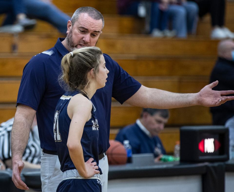 Whitefield Academy coach Glenn Wathen gives instructions to Kylie Ritter during 24th District Girls tournament action against Bullitt East. Feb. 21, 2022
