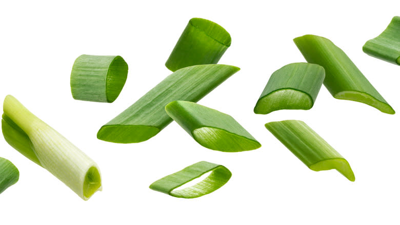 falling green onion slices