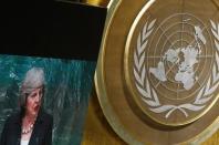 British Prime Minister Theresa May is shown on a large screen as she addresses the 71st United Nations General Assembly in Manhattan, New York, U.S. September 20, 2016. REUTERS/Carlo Allegri