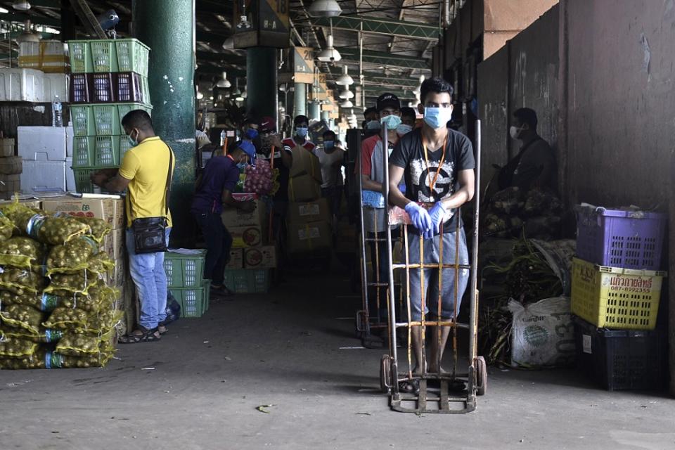 Foreign workers are pictured at Pasar Borong Kuala Lumpur in Selayang April 7, 2020. —Picture by Miera Zulyana