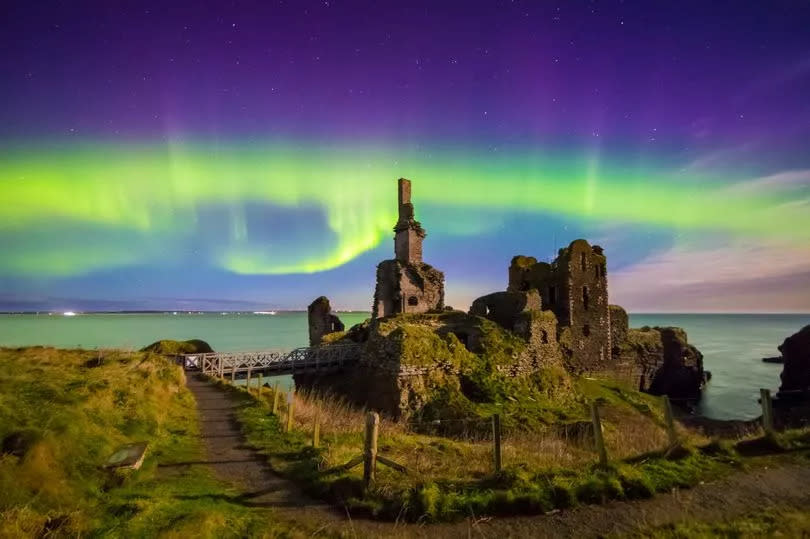 The Aurora Borealis over Sinclair & Girnigoe Castle in Caithness, Scotland