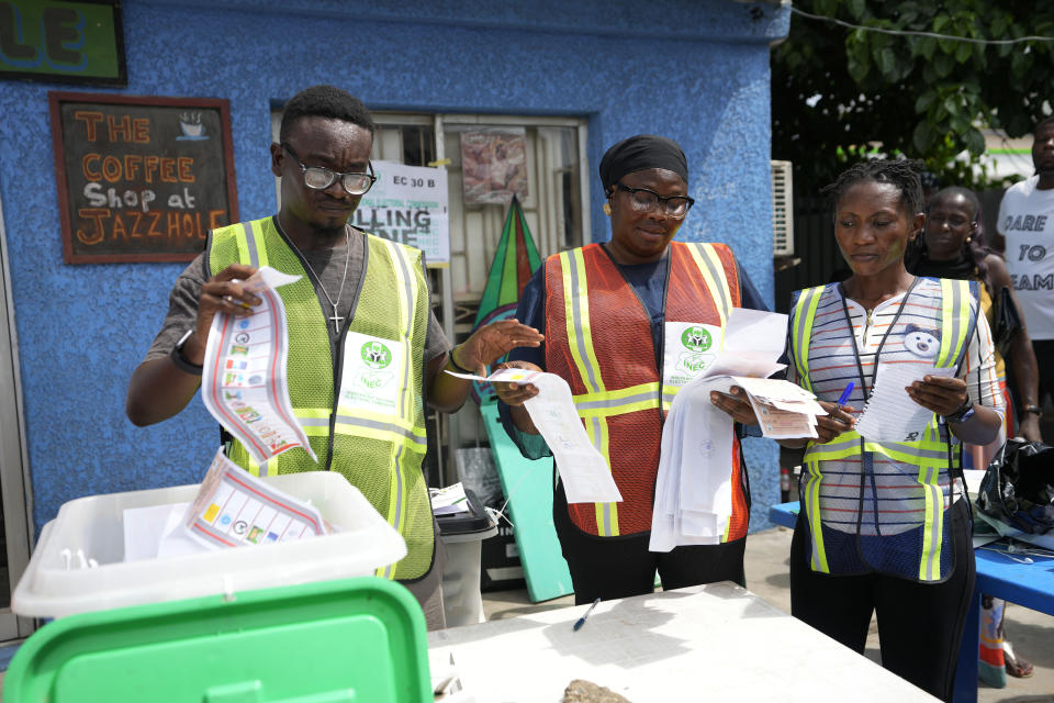 Electoral officials count ballots in front of party agents and observers at a polling station in Lagos, Nigeria, Saturday, March 18, 2023. Millions of Nigerians are headed back to the polls Saturday as Africa's most populous nation holds gubernatorial elections amid tensions after last month's disputed presidential vote. New governors are being chosen for 28 of Nigeria's 36 states as the opposition continues to reject the victory of President-elect Bola Tinubu from the West African nation's ruling party (AP Photo/Sunday Alamba)