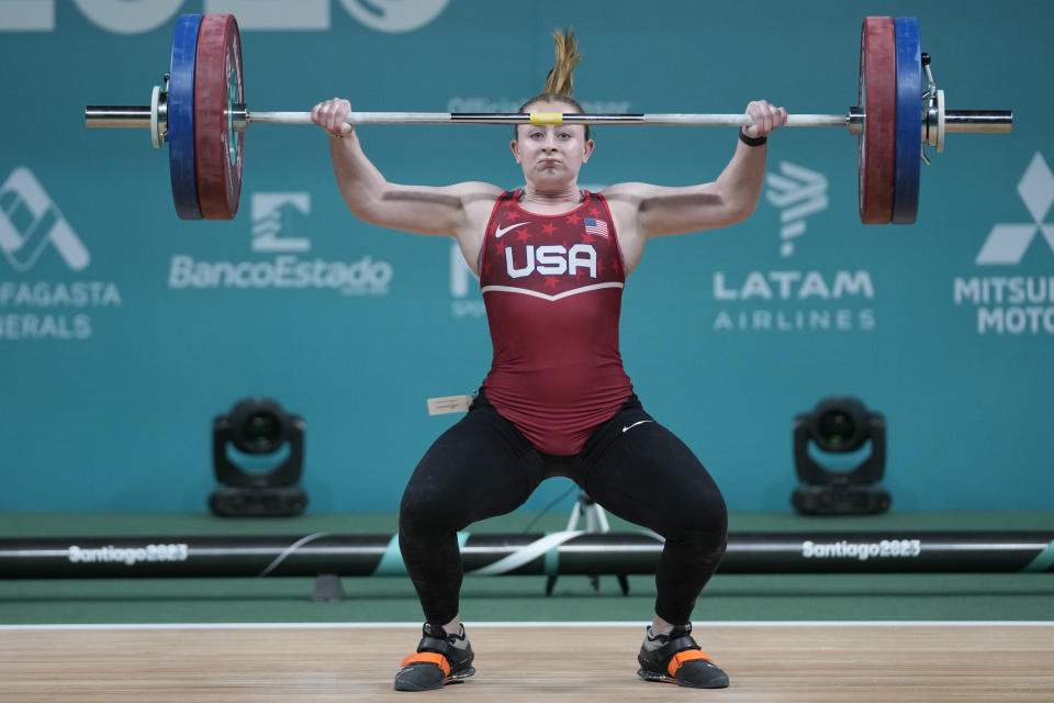 FILE - Olivia Reeves of the United States lifts in the women's 81kg weightlifting event at the Pan American Games in Santiago, Chile, Monday, Oct. 23, 2023. (AP Photo/Moises Castillo, File)