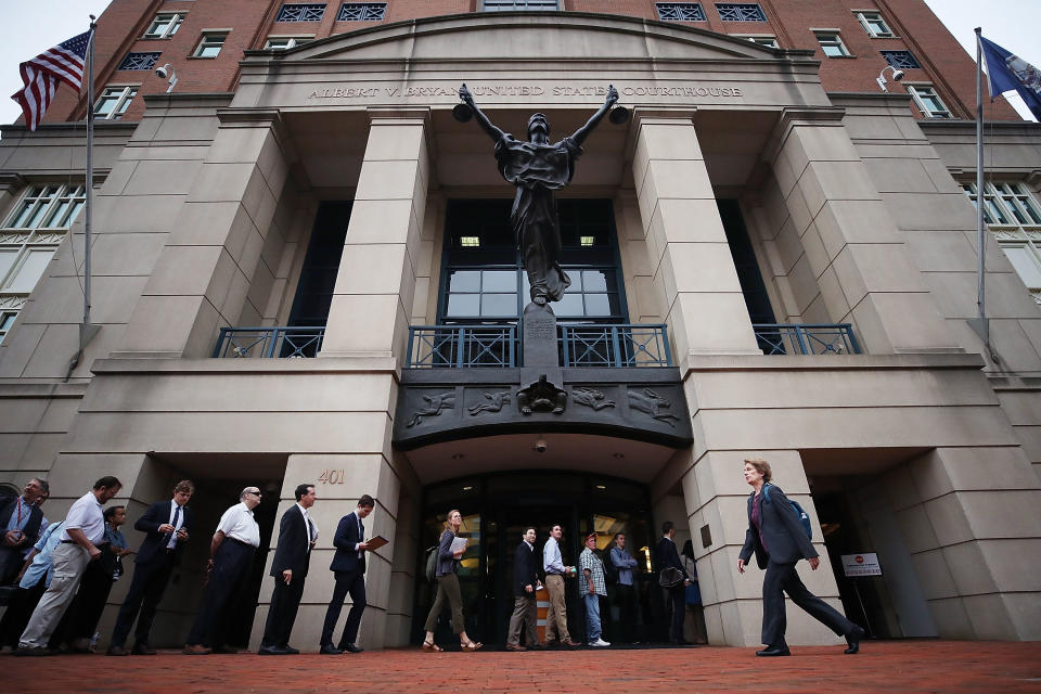 <p>People wait in line to enter the Albert V. Bryan United States Courthouse to attend the trial of former Trump campaign manager Paul Manafort was arrested last year on financial fraud charges, on July 31, 2018 in Alexandria, Va. (Photo: Mark Wilson/Getty Images) </p>