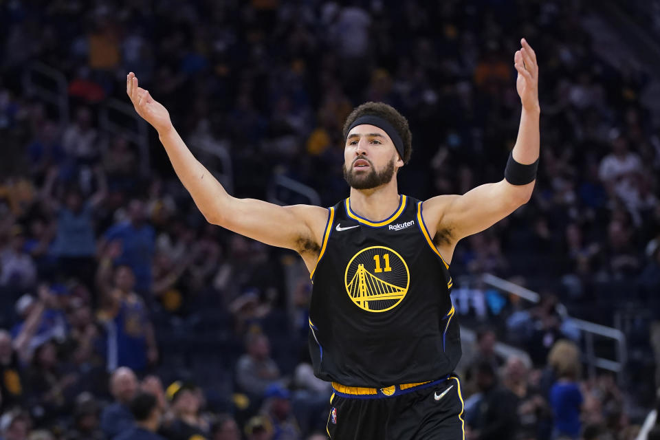 Golden State Warriors guard Klay Thompson (11) celebrates after making a 3-point basket against the Memphis Grizzlies during the second half of Game 3 of an NBA basketball Western Conference playoff semifinal in San Francisco, Saturday, May 7, 2022. (AP Photo/Jeff Chiu)