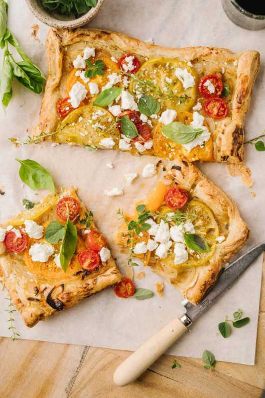 <p>Baked Bree</p><p>This easy and elegant recipe for tomato and feta tart uses store-bought puff pastry to make a mouth-watering open-face pie crust that gets topped with creamy mustard, caramelized onion, tomato, feta cheese and fresh herbs.</p><p><strong>Get the recipe: <a href="https://bakedbree.com/tomato-and-feta-tart" rel="nofollow noopener" target="_blank" data-ylk="slk:Tomato and Feta Tart;elm:context_link;itc:0;sec:content-canvas" class="link rapid-noclick-resp"><em>Tomato and Feta Tart</em></a></strong></p>