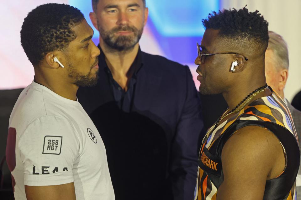 British boxer Anthony Joshua (L) and Cameroonian-French boxer Francis Ngannou look on after a press conference ahead of their boxing fight at the Kingdom Arena in Riyadh on March 6, 2024. (Photo by Fayez Nureldine / AFP) (Photo by FAYEZ NURELDINE/AFP via Getty Images)