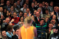 NEW YORK, NY - MARCH 05: Golfer Rory McIlroy of Northern Ireland is encouraged by his girlfriend Caroline Wozniacki of Denmark to join her on the court during her match against Maria Sharapova of Russia during the BNP Paribas Showdown at Madison Square Garden on March 5, 2012 in New York City. (Photo by Chris Trotman/Getty Images)