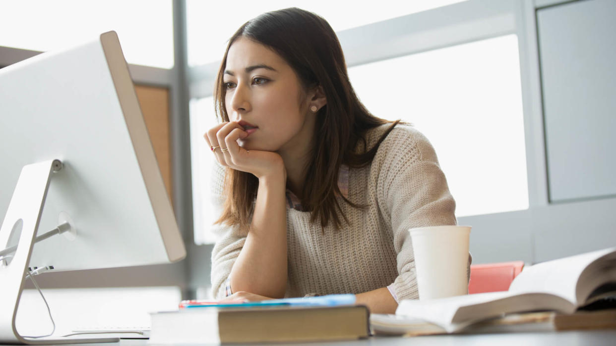 young woman browsing on her computer