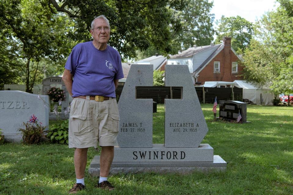Jim Swinford, 84, stands with the headstone in Battle Grove Cemetery in Cynthiana, Kentucky, where he and his wife will be buried. 
July 13, 2022