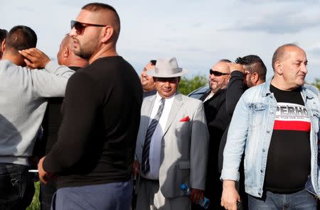 Roma people gather on the outskirts of the town to commemorate the killings of Roma people by right-wing militants in 2009, in Torokszentmiklos, Hungary, May 21, 2019. REUTERS/Bernadett Szabo