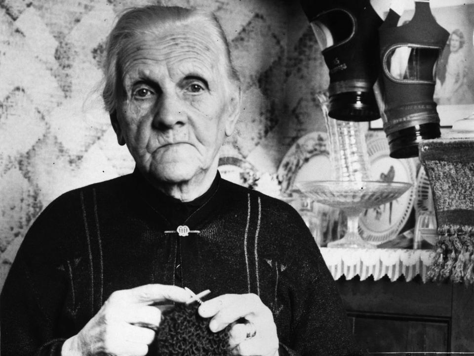 An 80-year-old woman, who lost five of her six sons during World War II, knits in 1938.