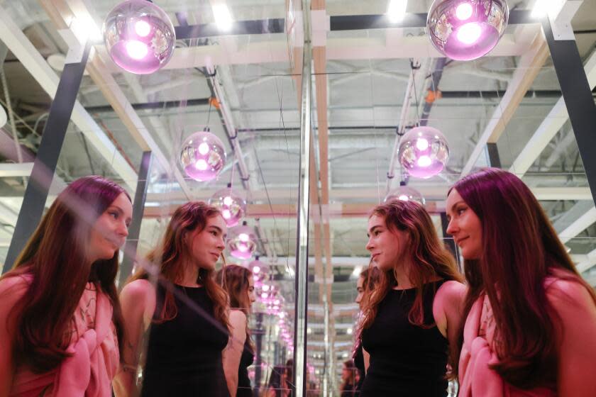 Burbank, CA - October 02: Mary Boo Anderson, left, and Zoe Blair-Schlagenhauf, right, co-creators of an underground Ikea residency program, pose for a portrait inside Ikea on Monday, Oct. 2, 2023 in Burbank, CA. The program selects fellows to create using Ikea as their backdrop and it represents a growing creative class of DIYers reimagining the disappearing "third space" in their own image. (Dania Maxwell / Los Angeles Times)