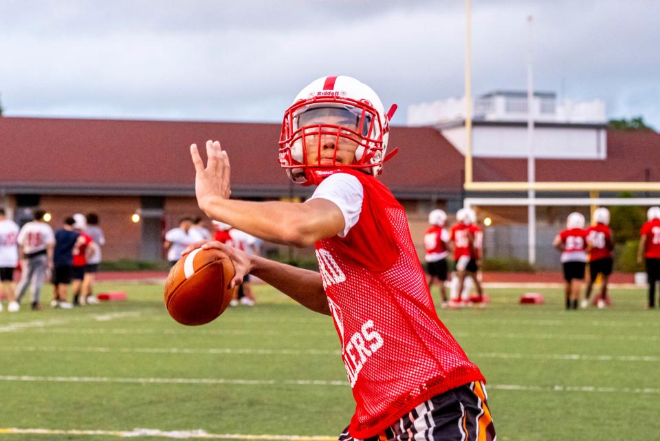 New Bedford's Amari Harris looks down field for his target at preseason training.