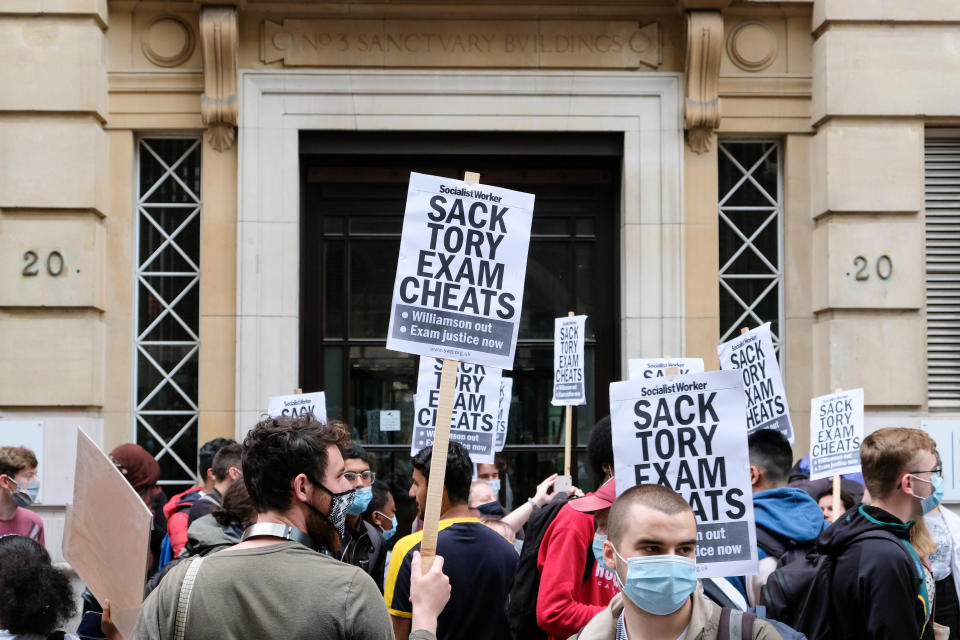 LONDON, UNITED KINGDOM - AUGUST 14, 2020: Protest outside the Department for Education after students affected by the mass downgrading of A-level results in England  - PHOTOGRAPH BY Matthew Chattle / Barcroft Studios / Future Publishing (Photo credit should read Matthew Chattle/Barcroft Media via Getty Images)