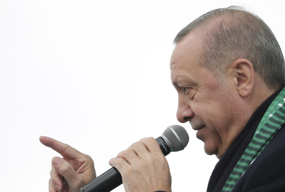 Turkey's President Recep Tayyip Erdogan delivers a speech during a rally in Konya, Turkey, Monday, Dec. 17, 2018. Erdogan said he received "positive answers" from U.S. President Donald Trump on the situation in northern Syria, where Turkey has threatened to launch a new operation against American-backed Syrian Kurdish fighters. The two leaders spoke by phone Friday. (Presidential Press Service via AP, Pool)