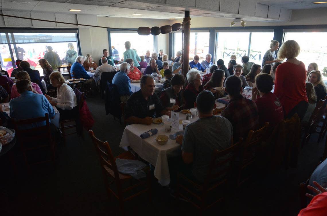 The annual Community Thanksgiving Dinner at Hudson’s Seafood on the Docks features turkey, dressing and all the trimmings served family-style.