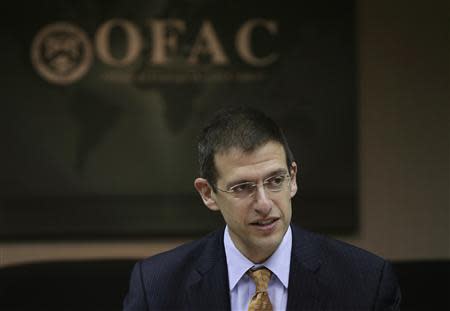 Office of Foreign Assets Control (OFAC) Director Adam Szubin and his staff (not pictured) meet at the U.S. Treasury Department in Washington March 26, 2014. REUTERS/Gary Cameron