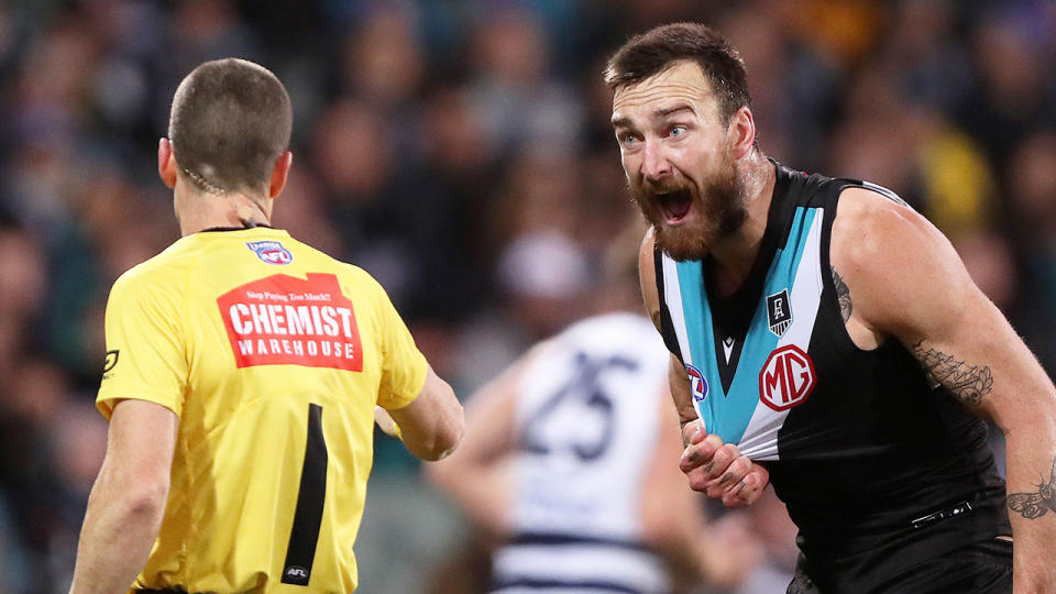 Seen here, Port Power's Charlie Dixon argues with an umpire in the AFL.