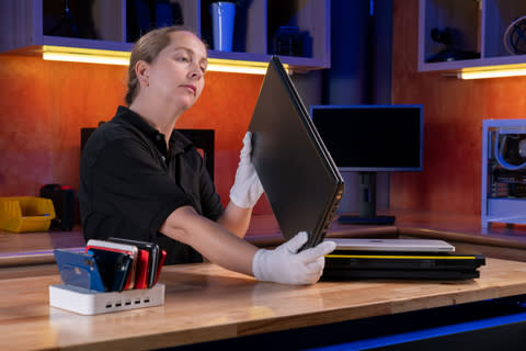 Tauna Carson inspects the ports on a laptop. Newegg launched Newegg Refreshed, a new refurbishment program that offers top pre-owned products at competitive prices. (Photo: Newegg)