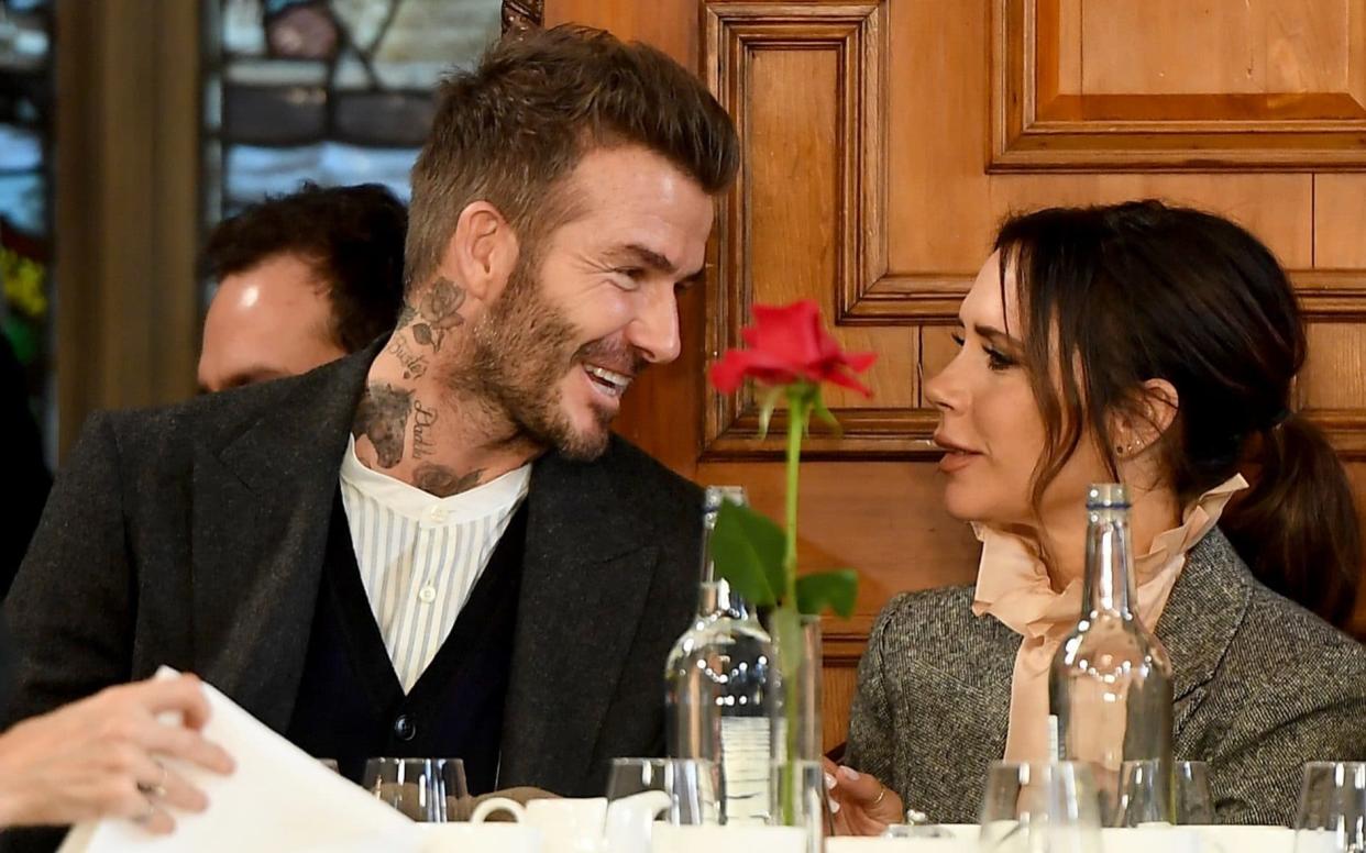 David and Victoria Beckham pictured during London Fashion Week earlier this month - Getty Images Europe