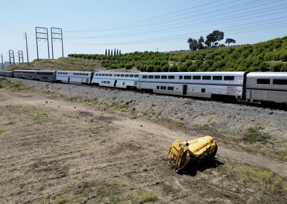 Part of a derailed train that struck a water truck lies on the ground in Moorpark, Calif., on Wednesday, June 28, 2023. (Dean Musgrove/The Orange County Register via AP)