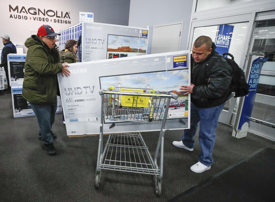 CHICAGO, IL - NOVEMBER 22: Shoppers load a big screen TV into their cart at a Best Buy Inc. store on November 22, 2018 in Chicago, Illinois. Known as 'Black Friday', the day after Thanksgiving marks the beginning of the holiday shopping season, with many retailers opening their doors on Thursday evening. (Photo by Kamil Krzaczynski/Getty Images)