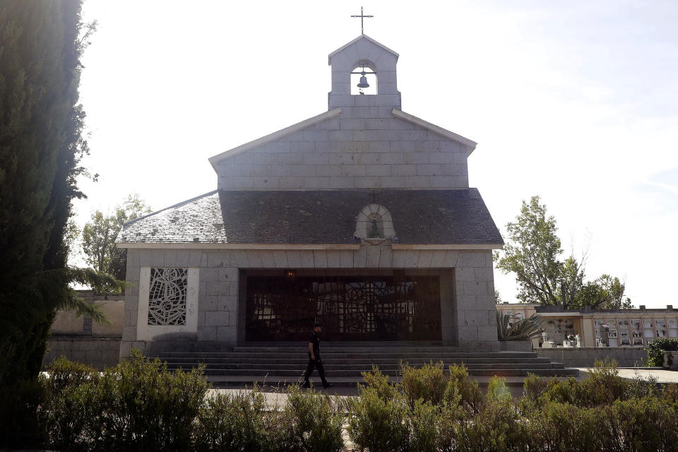 In this photo taken on Thursday, Oct. 3, 2019, a Spanish police walks past Franco's family tomb in Mingorrubio's cemetery, outskirts of Madrid. After a tortuous judicial and public relations battle, Spain's Socialist government has announced that Gen. Francisco Franco's embalmed body will be relocated from a controversial shrine to a small public cemetery where the former dictator's remains will lie along his deceased wife. (AP Photo/Manu Fernandez)