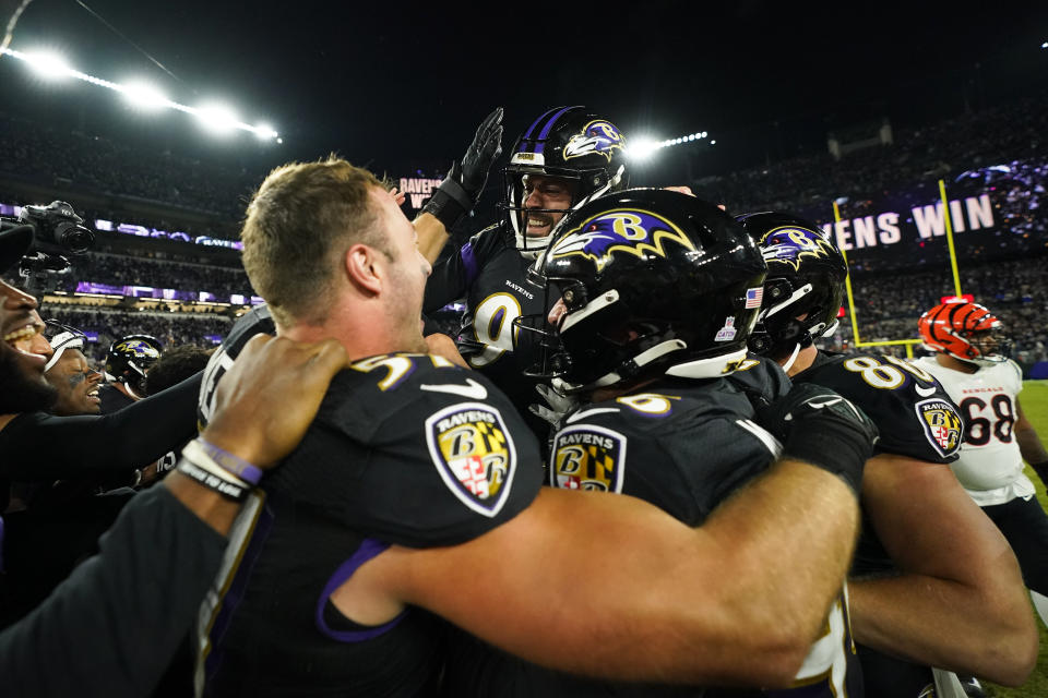 Baltimore Ravens place kicker Justin Tucker celebrates with teammates after they defeated the Cincinnati Bengals an NFL football game, Sunday, Oct. 9, 2022, in Baltimore. (AP Photo/Julio Cortez)
