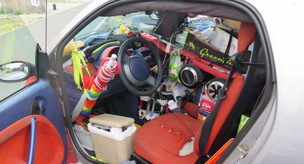 The Smart car German cops stopped from continuing its journey after they found it was completely packed full of household items - including around the pedals (CEN) 