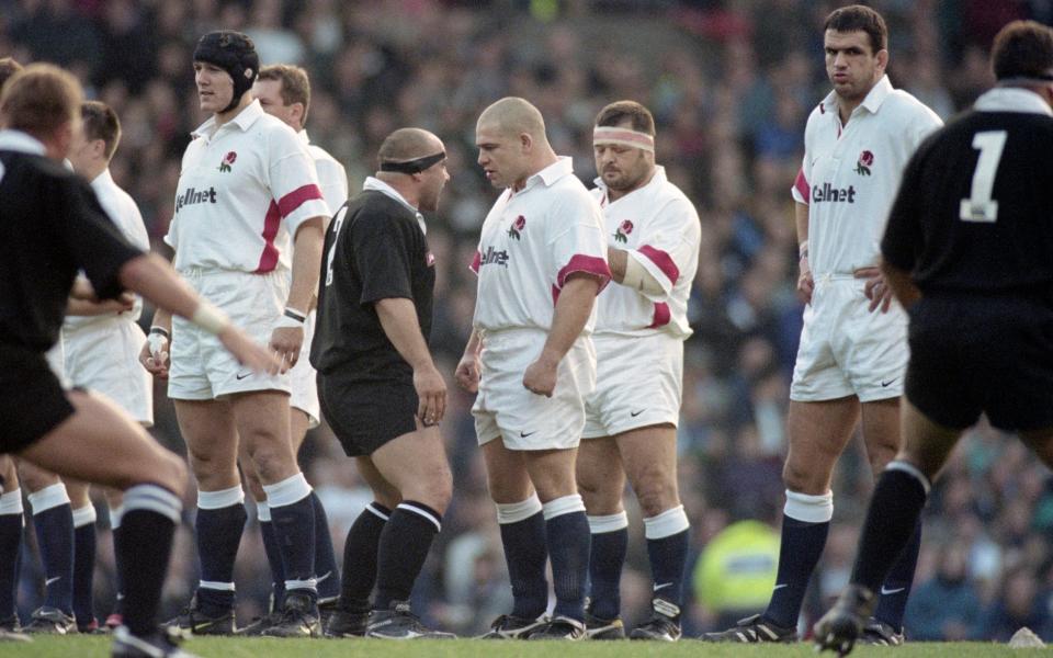 Richard Cockerill of England confronts Norm Hewitt of New Zealand during the Haka as Darren Garforth (2nd r) and Martin Johnson (r) look on before an All Blacks tour match against England at Old Trafford on November 22, 1997 in Manchester, United Kingdom - Stu Forster/Getty Images