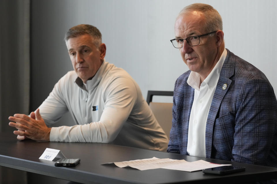 Big Ten Conference commissioner Tony Petitti, left, and Southeastern Conference commissioner Greg Sankey, right, hold a news conference after the two conferences held meetings Thursday, Oct. 10, 2024, in Nashville, Tenn. (AP Photo/George Walker IV)