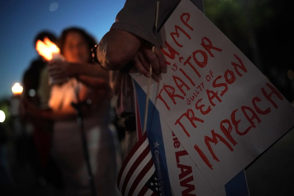 <p>Activists participate in a vigil in front of the White House, July 18, 2018, in Washington, D.C. (Photo: Alex Wong/Getty Images) </p>