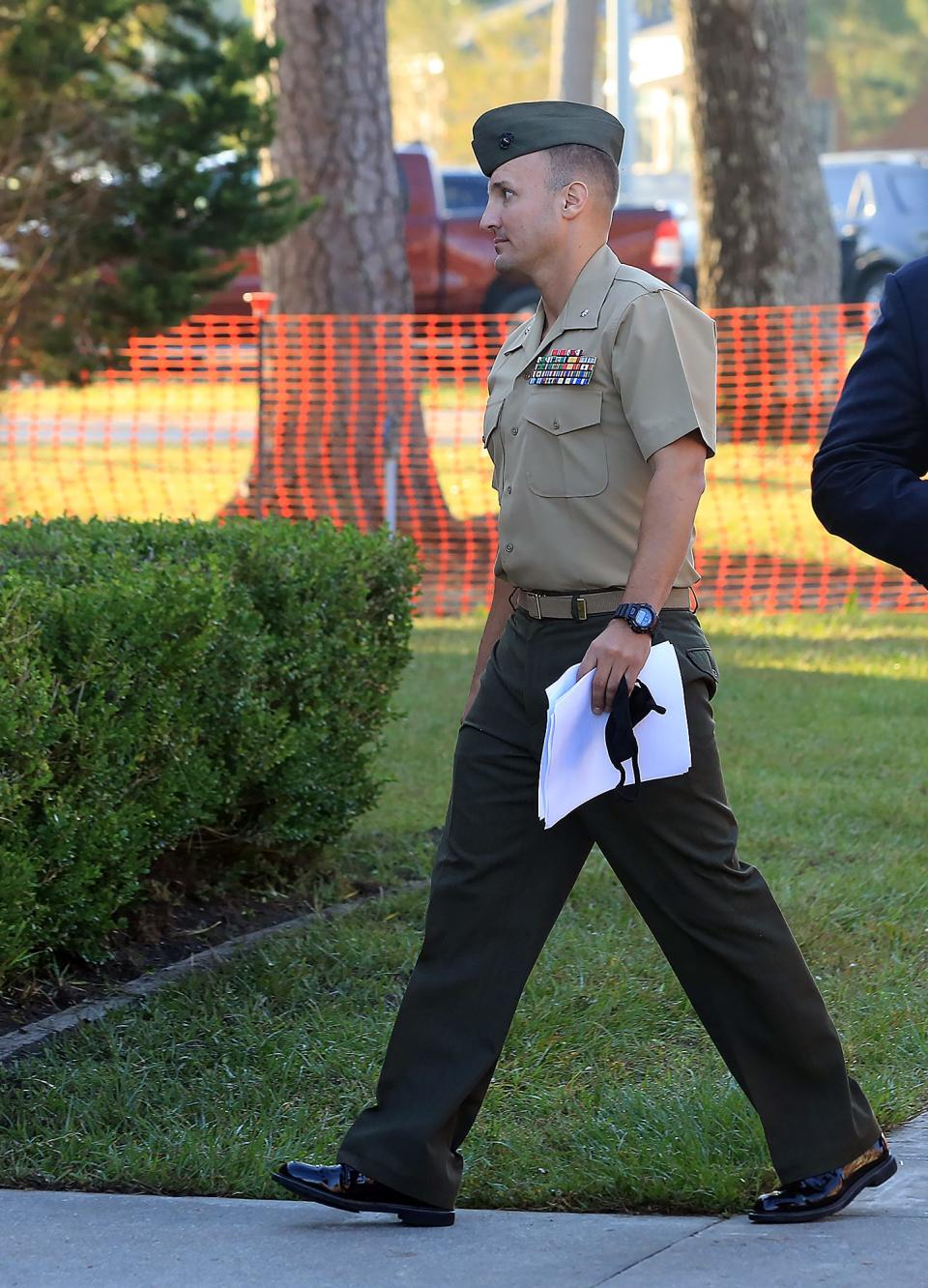Lt. Col. Stuart Scheller Jr. walks to the courtroom on Camp Lejeune in Jacksonville NC on Thursday, Oct. 14, 2021. Scheller is being court-martialed after he publicly criticized the U.S. withdrawal from Afghanistan.