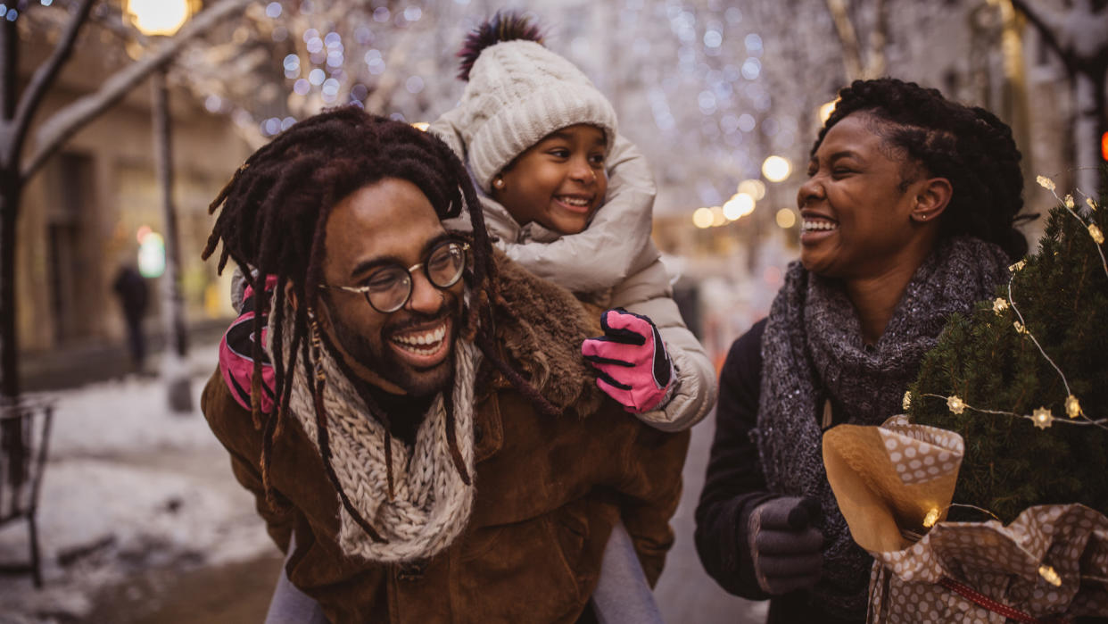 Young family preparing for Christmas holiday.