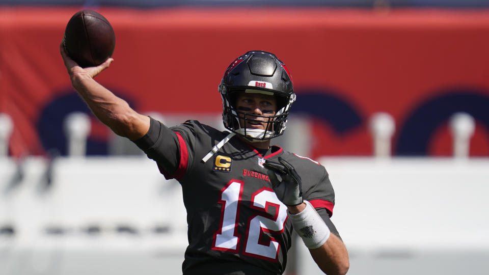 Tampa Bay Buccaneers quarterback Tom Brady warms up before an NFL football game against the Denver Broncos, Sunday, Sept. 27, 2020, in Denver. (AP Photo/Jack Dempsey)