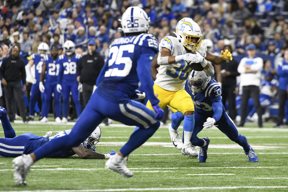 INDIANAPOLIS, IN - DECEMBER 26: Los Angeles Chargers running back Austin Ekeler (30) advances the ball during the NFL football game between the Los Angeles Chargers and the Indianapolis Colts on December 26, 2022, at Lucas Oil Stadium in Indianapolis, Indiana. (Photo by Michael Allio/Icon Sportswire via Getty Images)