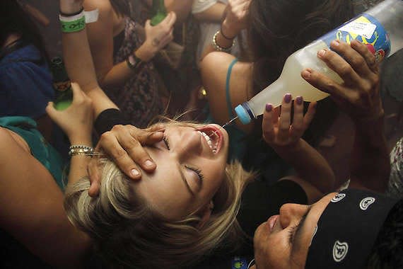 A woman drinks at a bar in Cancun, Mexico, during spring break in 2021. -- Associated Press